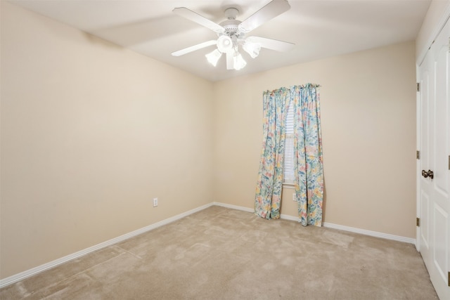 carpeted empty room with ceiling fan