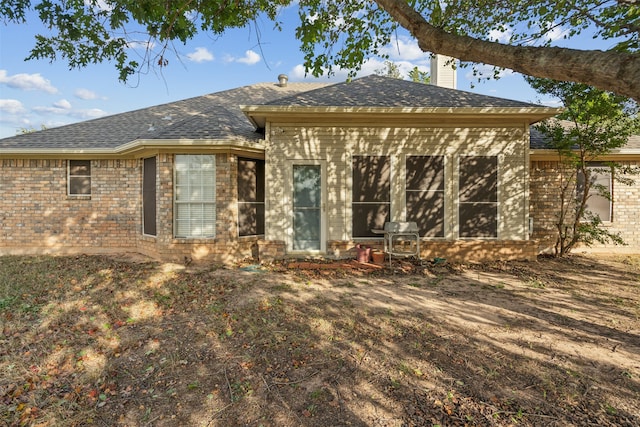 rear view of house with a sunroom