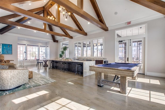 recreation room featuring pool table, light wood-type flooring, french doors, high vaulted ceiling, and a chandelier