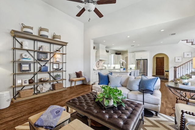 living room featuring ceiling fan and light hardwood / wood-style flooring