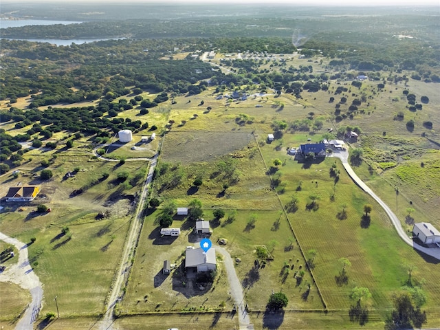 birds eye view of property featuring a rural view and a water view