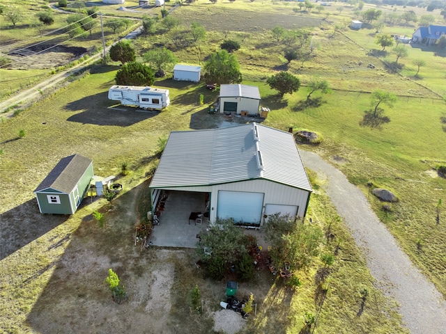 birds eye view of property featuring a rural view