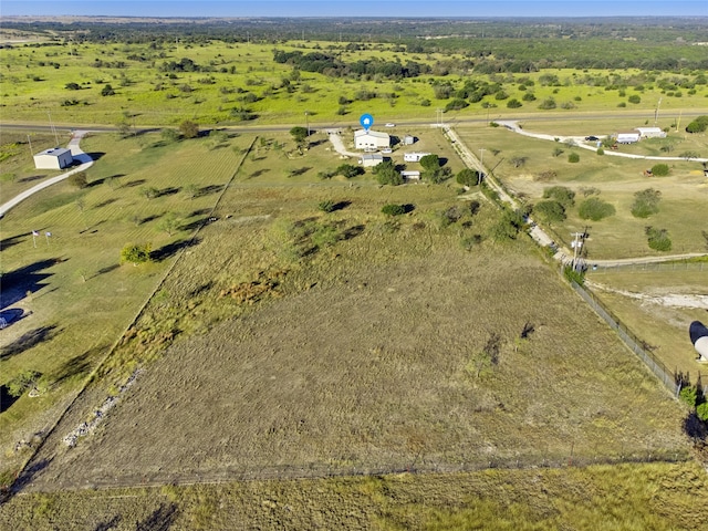 birds eye view of property featuring a rural view