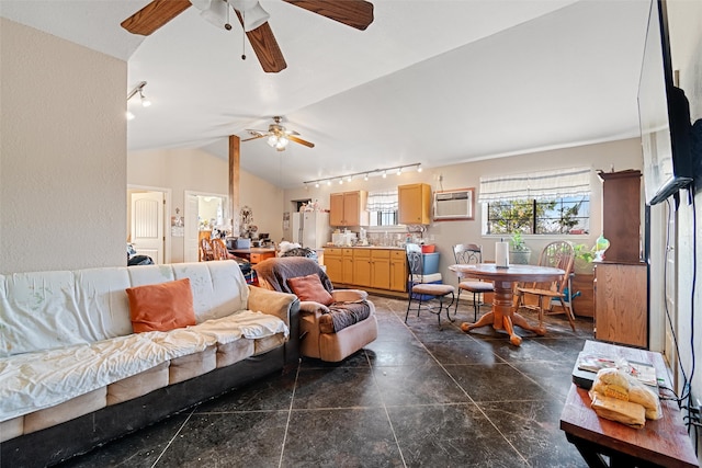 living room with a wall unit AC, ceiling fan, rail lighting, and vaulted ceiling