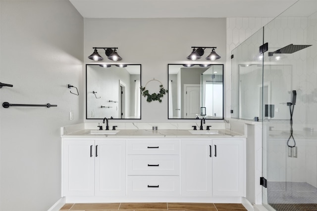 bathroom with vanity, an enclosed shower, and tile patterned floors