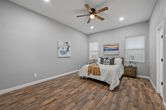 bedroom with dark wood-type flooring and ceiling fan