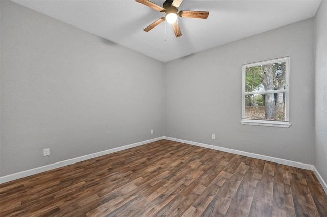 unfurnished room with dark hardwood / wood-style floors and ceiling fan