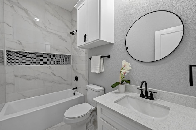 full bathroom featuring vanity, toilet, and tiled shower / bath combo