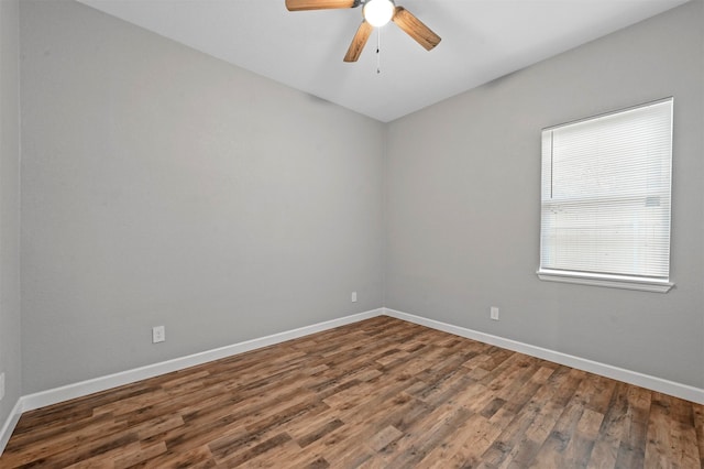 spare room with hardwood / wood-style flooring and ceiling fan