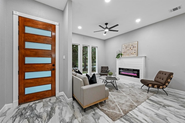 living room featuring ceiling fan