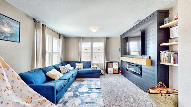 living room with a textured ceiling and carpet flooring