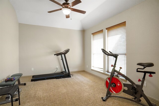 exercise area with ceiling fan, lofted ceiling, and carpet flooring