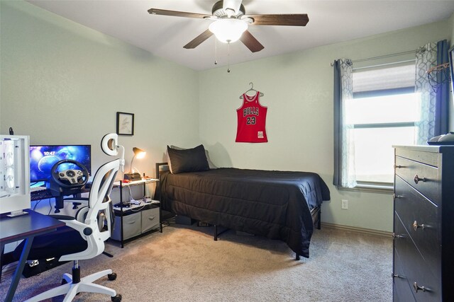 bedroom featuring light colored carpet and ceiling fan