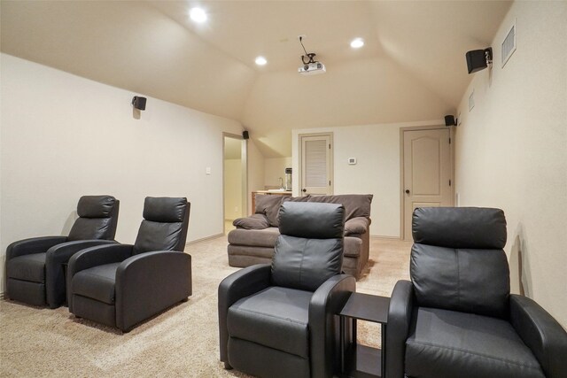 home theater featuring light colored carpet and high vaulted ceiling