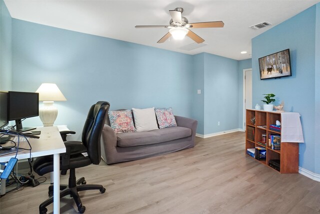 office area with ceiling fan and light hardwood / wood-style floors