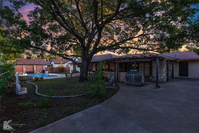 exterior space featuring a fenced in pool, a patio area, and a pergola