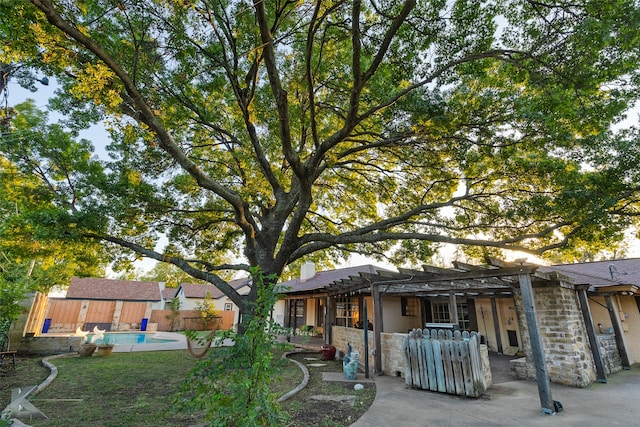 exterior space with a pergola, a patio, and a fenced in pool