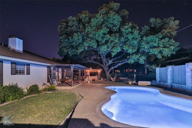 view of swimming pool featuring a pergola and a patio