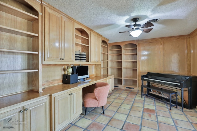 dining space with a textured ceiling, dark hardwood / wood-style floors, ceiling fan, and ornamental molding