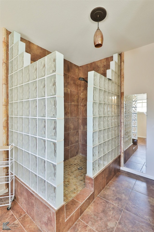 bathroom with tile patterned flooring, vanity, and ceiling fan