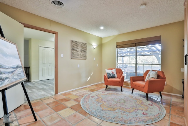 bedroom with light hardwood / wood-style floors, sink, connected bathroom, and french doors