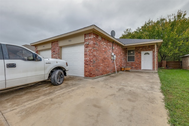 ranch-style house with a front lawn and a garage