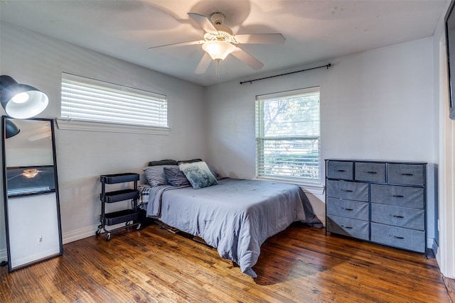 bedroom featuring ceiling fan and dark hardwood / wood-style flooring