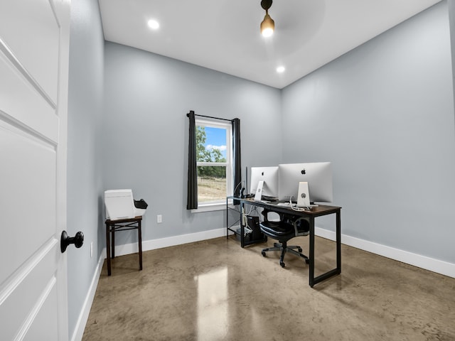 home office with finished concrete floors, baseboards, and recessed lighting