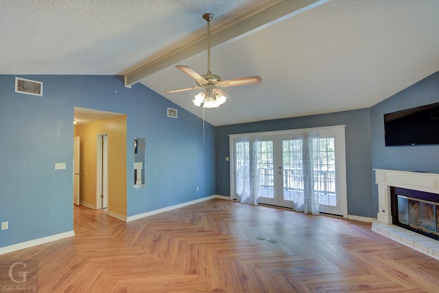 clothes washing area featuring separate washer and dryer, light tile patterned floors, cabinets, and a textured ceiling