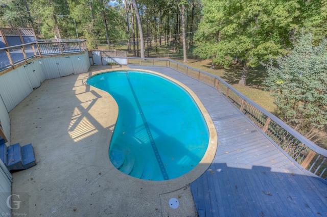 view of pool featuring a wooden deck