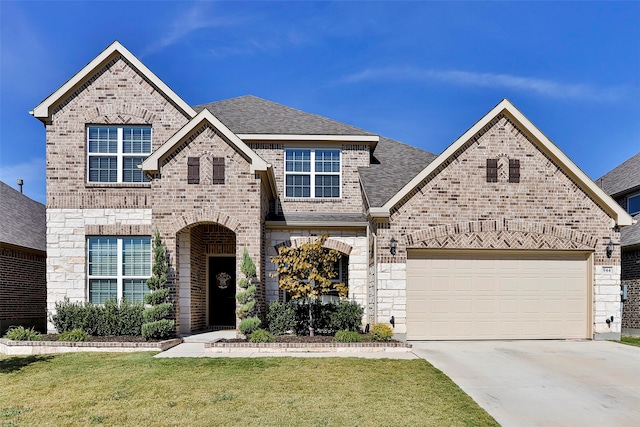 view of front of property with a front lawn and a garage