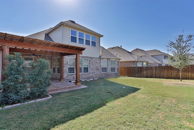 back of property featuring a patio and a lawn