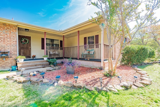 single story home featuring covered porch