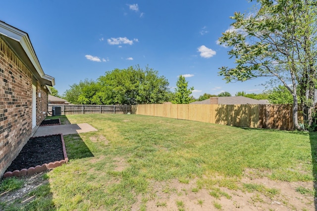 view of yard featuring a patio area and a fenced backyard