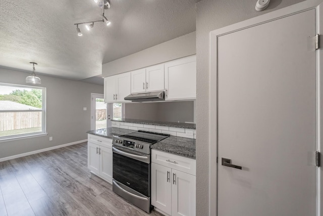 kitchen with a healthy amount of sunlight, white cabinets, and stainless steel electric range oven