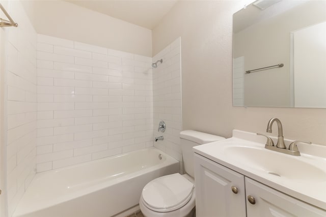 full bathroom with toilet, tiled shower / bath combo, and vanity