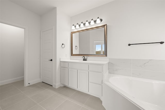 bathroom featuring vanity, tile patterned flooring, and a bathtub