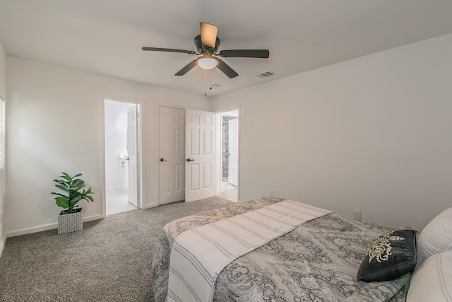 bedroom with carpet flooring, connected bathroom, and ceiling fan