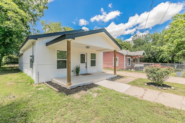 view of front of property with a front yard and a porch