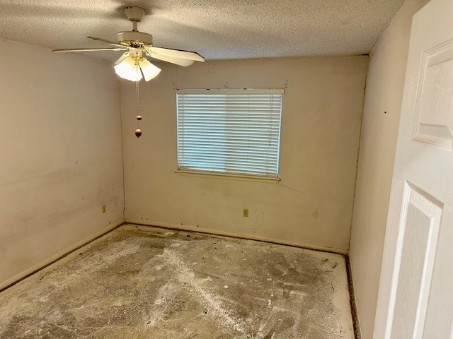 unfurnished room featuring a textured ceiling and ceiling fan