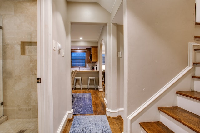 corridor with dark wood-type flooring