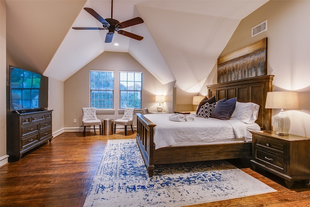 bedroom with vaulted ceiling, dark hardwood / wood-style floors, and ceiling fan