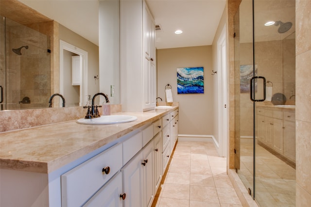 bathroom with vanity, tile patterned floors, and walk in shower