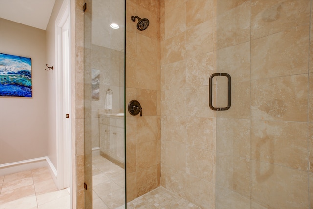 bathroom featuring tile patterned floors and a shower with shower door