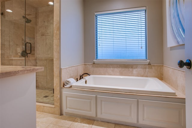 bathroom with tile patterned floors and separate shower and tub