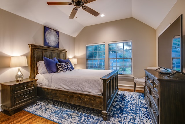 bedroom featuring ceiling fan, vaulted ceiling, and dark hardwood / wood-style floors