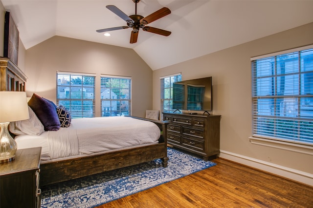 bedroom with vaulted ceiling, wood-type flooring, and ceiling fan