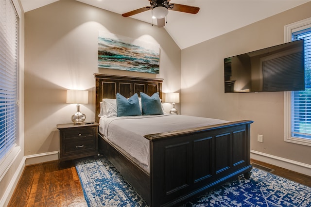 bedroom featuring ceiling fan, vaulted ceiling, and dark hardwood / wood-style floors