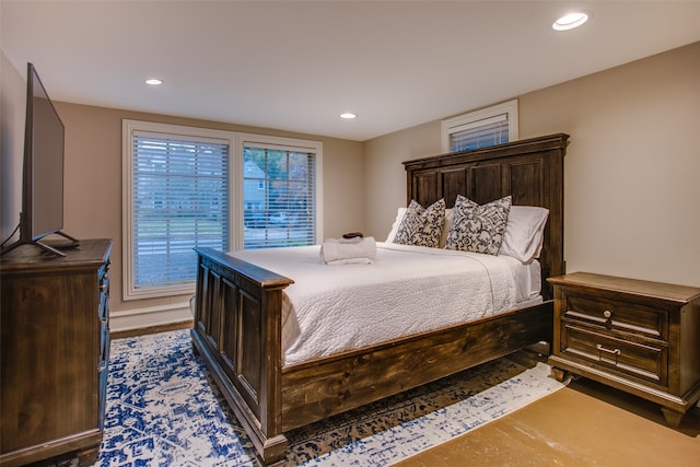 bedroom with dark wood-type flooring