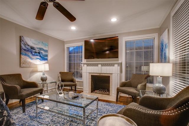 tiled living room featuring crown molding and ceiling fan